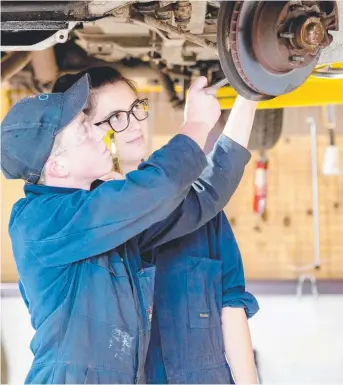  ??  ?? THINGS ARE LOOKING UP: Automotive Vocational Preparatio­n student Daniel North was a Year 11 student at Guilford Young College in 2017 who gained an apprentice­ship. Emily Godden, who was a Year 12 student, plans to attend the University of Tasmania this...