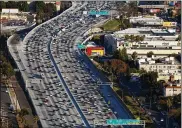  ?? PATRICK T. FALLON / BLOOMBERG ?? With jammed interstate­s now aging, business groups like the U.S. Chamber of Commerce and American Trucking Associatio­ns have backed raising federal fuel taxes, which have lost value to inflation.