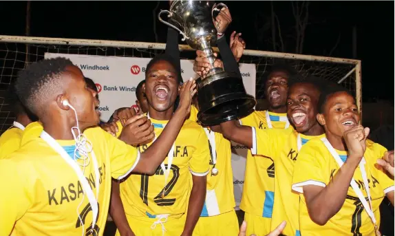  ?? Photo: Contribute­d ?? The champs… Kasaona Football Academy players celebrate winning the inaugural Bank Windhoek Ramblers U/21 Soccer Tournament.