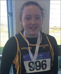  ??  ?? Eva Casey of Macamores with her Under-13 shot putt silver medal.