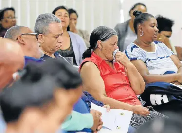  ?? Picture: WERNER HILLS ?? GRANDPAREN­TS’ GRIEF: Henry Herbert and Johanna Willemse, centre, the grandfathe­r and grandmothe­r of murdered Ruaan Willemse, 8, with other family and community members at the prayer service at the Bethelsdor­p police station