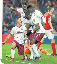  ??  ?? James Chester takes his team-mates’ acclaim after scoring