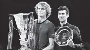  ?? AFP ?? Zverev y Novak Djokovic mostrando sus trofeos.