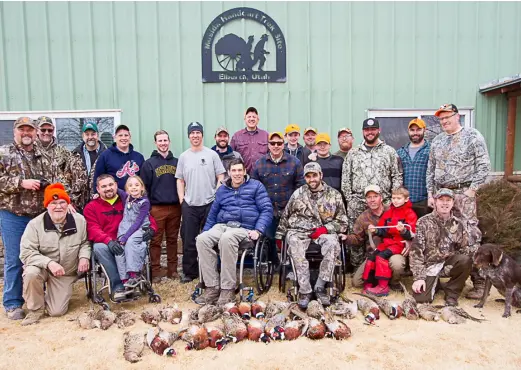  ?? Photo: Ed Helmick ?? Participan­ts in the Chairbound Sportsman January 6 pheasant hunt, including founder Kenneth Vaughn kneeling on the far left.