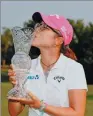  ?? GREGORY SHAMUS / GETTY IMAGES/
AFP ?? Lydia Ko kisses the Marathon Classic trophy at Highland Meadows Golf Club in Sylvania, Ohio, on Sunday.