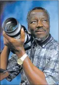  ?? Picture: LEN KUMALO ?? EYE ON ACTION: Sam Nzima, who shot the famous picture of Hector Pietersen