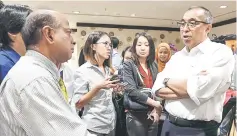  ??  ?? Salleh (right) fielding questions from members of various media during the ‘Kupi-Kupi Session’. — Bernama photo