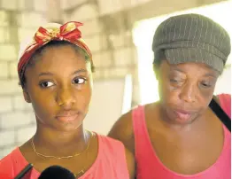  ?? RICARDO MAKYN/CHIEF PHOTO EDITOR ?? Tiana Cooke, sister of Winshae Barrett, talks to journalist­s in the presence of her aunt, Paula Douglas, on Sunday.