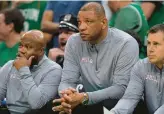  ?? STEVEN SENNE/AP ?? 76ers head coach Doc Rivers, center, watches from the bench during Game 7 of the Eastern Conference semifinals against the Celtics on Sunday in Boston.