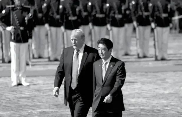  ??  ?? President Donald Trump and Japan Prime Minister Shinzo Abe participat­e in an honor guard ceremony at the Akasaka Palace, Monday, Nov. 6, 2017, in Tokyo. (AP)