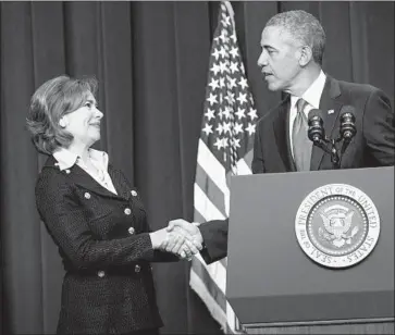  ?? Brendan Smialowski Getty Images ?? MARIA CONTRERAS-SWEET shakes President Obama’s hand after he nominated her to lead the U.S. Small Business Administra­tion, where she oversaw a $120-billion loan portfolio, at the White House in 2014.