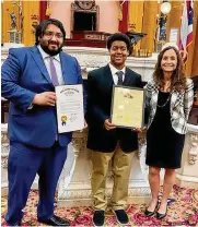  ?? CONTRIBUTE­D PHOTO ?? Jamari Jones (center) receives the 2022 Ohio Military Youth of the Year Award from state Sen. Niraj Antani (left) and state Rep. Andrea White on April 6 in Dayton. The Wright-Patterson Air Force Base teenager now moves on to compete at the regional level in Chicago.