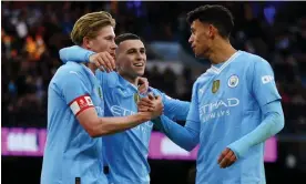  ?? Photograph: Lee Smith/Action Images/ Reuters ?? Manchester City's Kevin De Bruyne (left) came off the bench to provide an assist, while Phil Foden (centre) scored twice against Huddersfie­ld.