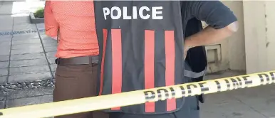  ?? FILE ?? Police use yellow tape to block off the entrance to the Kingston Mall in downtown Kingston during their investigat­ion into a murder-suicide in 2016. A security guard reportedly shot and killed his girlfriend at the scene before killing himself.