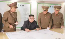  ?? REUTERSPIX ?? Kim visits the Command of the Strategic Force of the Korean People’s Army in an unknown location in North Korea in this undated photo released by KCNA news agency yesterday.