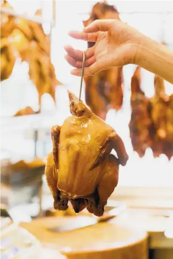  ?? Photos by Jason Henry / Special to The Chronicle ?? Chicken braised with soy sauce, sugar and star anise at Guangdong Barbecue Tea House in S.F.