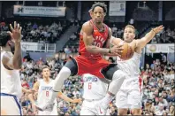  ?? AP PHOTO ?? In this Oct. 3 file photo, Toronto Raptors guard DeMar DeRozan, centre, makes a pass through the Los Angeles Clippers defense during the first quarter of a preseason NBA game in Honolulu.