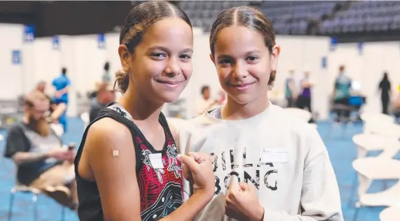  ?? Pictures: Brendan Radke ?? Twins Shiloh and Sienna Nakachi, 12, of Kanimbla were vaccinated at Cairns Convention Centre.