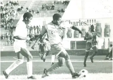  ?? PIC:CHARLES SIMUKOKO (MMEGI ARCHIVES) ?? Chikoti power: Township Rollers’ danger-man, Joseph Chikoti drives the ball while under attention from BDF XI’s Ezekiel Buisanyang during a Castle Super League match in this undated photo. Rollers won 2-0