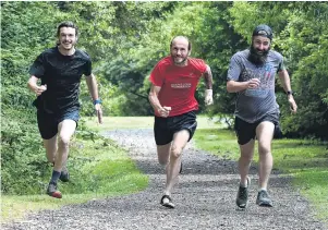  ?? PHOTO: GREGOR RICHARDSON ?? Longest stride . . . Preparing to run continuous­ly up Mt Cargill today are (from left) Isaac Tripp, Steve Tripp and Andrew Glennie.