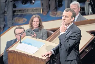  ?? ANDREW HARRER — BLOOMBERG ?? Emmanuel Macron, France’s president, gestures after speaking to a joint meeting of Congress at the U.S. Capitol.