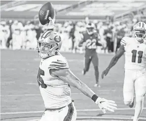  ?? KYLE TERADA/ USA TODAY SPORTS ?? 49ers tight end George Kittle celebrates after scoring on a 44- yard touchdown reception against the Rams.