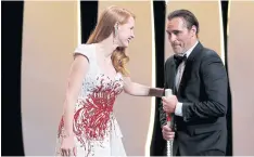  ??  ?? Jessica Chastain and Joaquin Phoenix at Cannes closing ceremony.