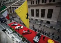  ?? MICHAEL NAGLE, BLOOMBERG ?? Ferraris are parked in front of the New York Stock Exchange earlier this month.