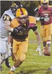  ?? STAFF PHOTO BY CHRIS CHRISTO ?? ELUSIVE PIGSKIN: Cardinal Spellman’s Jovan Marrero keeps his eye on a loose ball as Brendan McCarthy of St. Mary’s prevents him from recovering last night.