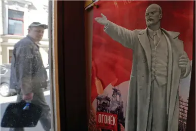  ?? (Reuters) ?? A HISTORIC poster of Vladimir Lenin on display in St. Petersburg.