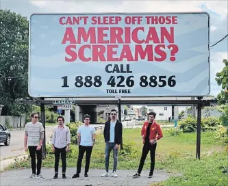  ?? UNIVERSAL CANADA ?? Arkells are pictured with their "American Screams" billboard in Buffalo, N.Y.