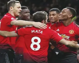  ??  ?? Manchester United celebrate Anthony Martial’s goal