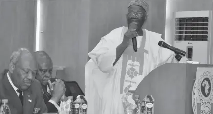  ?? PHOTO Abubakar Yakubu ?? Prof. Ibrahim Gambari, former under-secretary of the United Nations (right), presenting a paper titled ‘The role of the Diaspora in Africa’s Developmen­t’, during a symposium organised by the Directorat­e of Technical Corperatio­n in Africa, in Abuja yesterday.