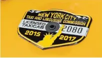  ??  ?? NEW YORK: In this photo, the medallion of taxi driver and taxi medallion owner Marcelino Hervias is affixed to the hood of his taxicab on New York’s Upper West Side.