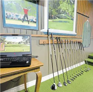  ?? PHOTOS BY JOHN RENNISON THE HAMILTON SPECTATOR ?? Inside Ken Bond’s garage golf paradise.