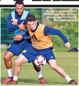  ??  ?? Brothers in arms: Matt Phillips and John McGinn give no quarter during Scotland training