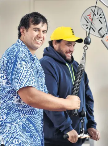  ?? PHOTO: PETER MCINTOSH ?? Building bodies . . . Te Kaika health hub cofounder Albie Laurence uses the facility’s gymnasium alongside Mauri Ora kaimahi David Reedy.