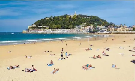  ?? CAMERON HEWITT/RICK STEVES’EUROPE ?? The golden sands of San Sebastian welcome visitors to the spirited Basque country.