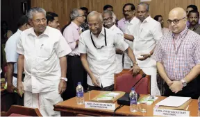  ??  ?? NOT MY PROBLEM: CM Pinarayi Vijayan (left) with IAS officers at a meeting