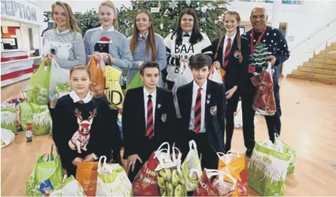  ??  ?? Students with bags of food collected at at The Academy at Shotton Hall.