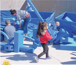  ?? COURTESY OF APS ?? Children play with the “Imaginatio­n Playground in a Cart,” interactiv­e, stackable foam pieces for building and playing, for the first time at the Albuquerqu­e Public Schools Aztec Special Education Complex.