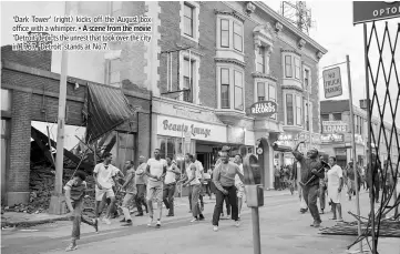  ??  ?? ‘Dark Tower' (right) kicks off the August box office with a whimper. • A scene from the movie ‘Detroit' depicts the unrest that took over the city in 1967. 'Detroit' stands at No.7.