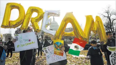  ?? Jose Luis Magana ?? The Associated Press Demonstrat­ors hold up balloons during an immigratio­n rally Dec. 6 in support of the Deferred Action for Childhood Arrivals program near the U.S. Capitol. President Donald Trump said Sunday that DACA is “probably dead.”