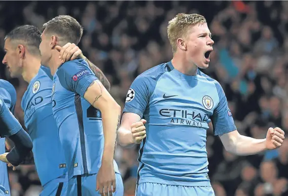  ??  ?? Kevin de Bruyne celebrates after firing in a superb free-kick to give Manchester City the lead in their 3-1 win over Barcelona at the Etihad.