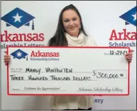  ?? Special to the Arkansas Democrat-Gazette ?? Mandy Vanhouten is pictured Dec. 27 after cashing a $300,000 lottery ticket that is the subject of a lawsuit.