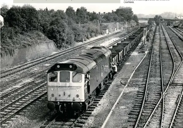  ?? CHAPMAN. BILL ?? Wagonload freight as it was. 25160 comes to a halt in the Down loop at Sutton Bridge (Shrewsbury) with an engineer’s train on June 5 1982. The sidings have long since been removed, and the site is submerged under tall trees.