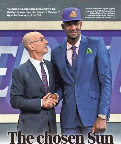  ?? AP ?? Arizona’s Deandre Ayton (right) poses with NBA Commission­er Adam Silver after the Suns selected Ayton with the No. 1 overall pick in the NBA draft.