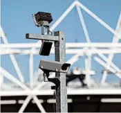  ?? SANG TAN/AP ?? Britain has long used video surveillan­ce in public spaces, such as this camera at the Olympic Stadium in 2012.