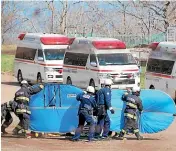  ?? AP ?? Firefighte­rs transfer a rescued person in Shari, in the northern island of Hokkaido, yesterday.