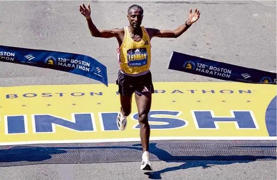  ?? Charles Krupa/associated Press ?? Sisay Lemma, of Ethiopia, wins the Boston Marathon on Monday. He ran 2:06:17, the 10th-fastest time in race history.